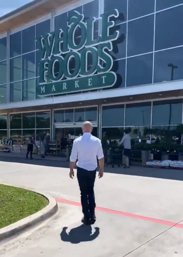 Jeff Bezos visited Amazon employees at an Amazon warehouse and a Whole Foods store