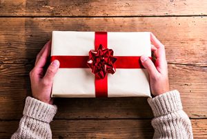 Man holding Christmas present